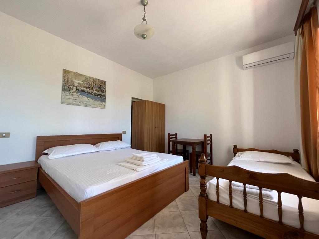 Postel nebo postele na pokoji v ubytování Rei’s place
