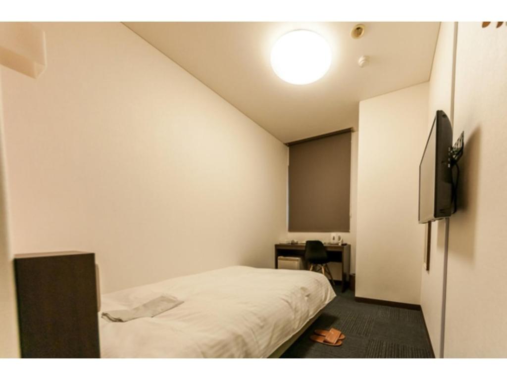 Säng eller sängar i ett rum på Mizuho Inn Iwami Masuda - Vacation STAY 17362v