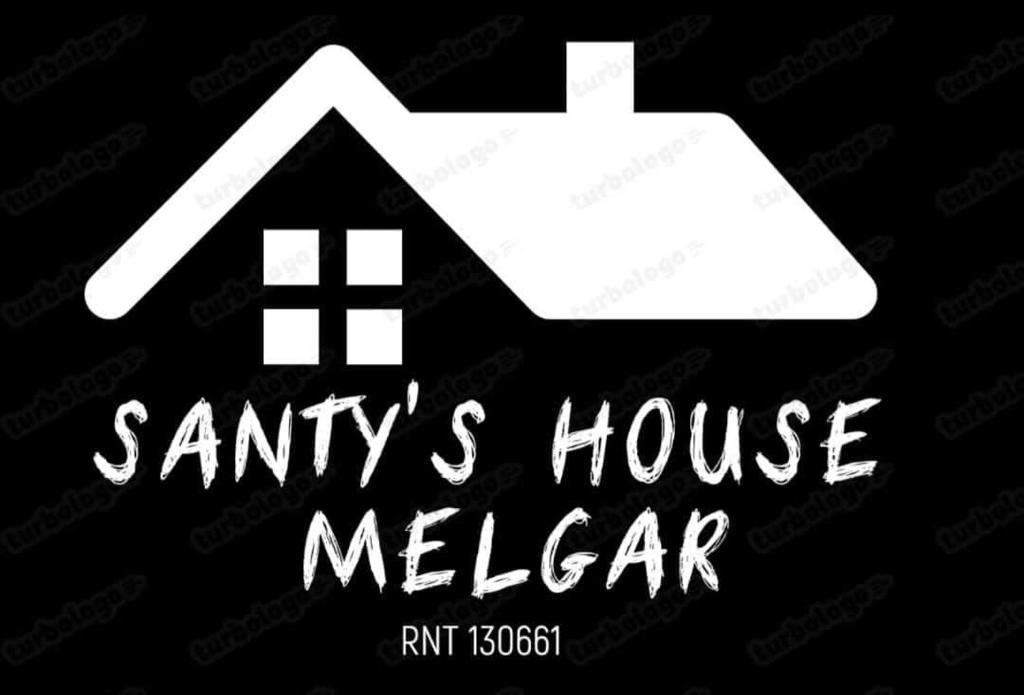 een bord voor een santas house melbourne deel bij SANTYS HOUSE MELGAR apartamentos amoblados con capacidad para 6 personas para 6 personas in Melgar