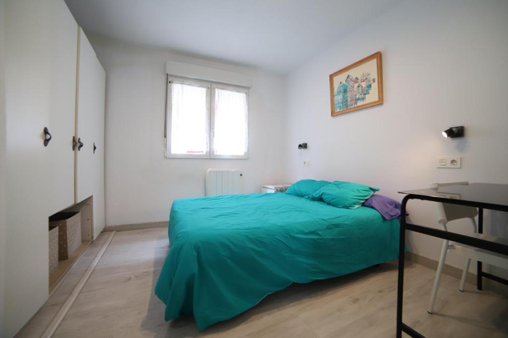 A bed or beds in a room at patio soleado DOS BAÑOS