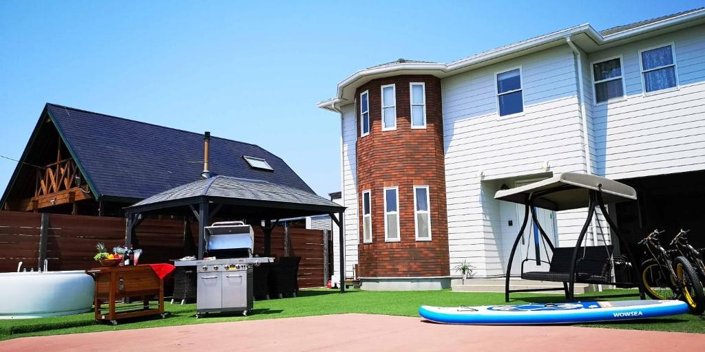 a house with a gazebo in front of a house at Ocean Resort Tateyama A House - Vacation STAY 73416v in Tateyama