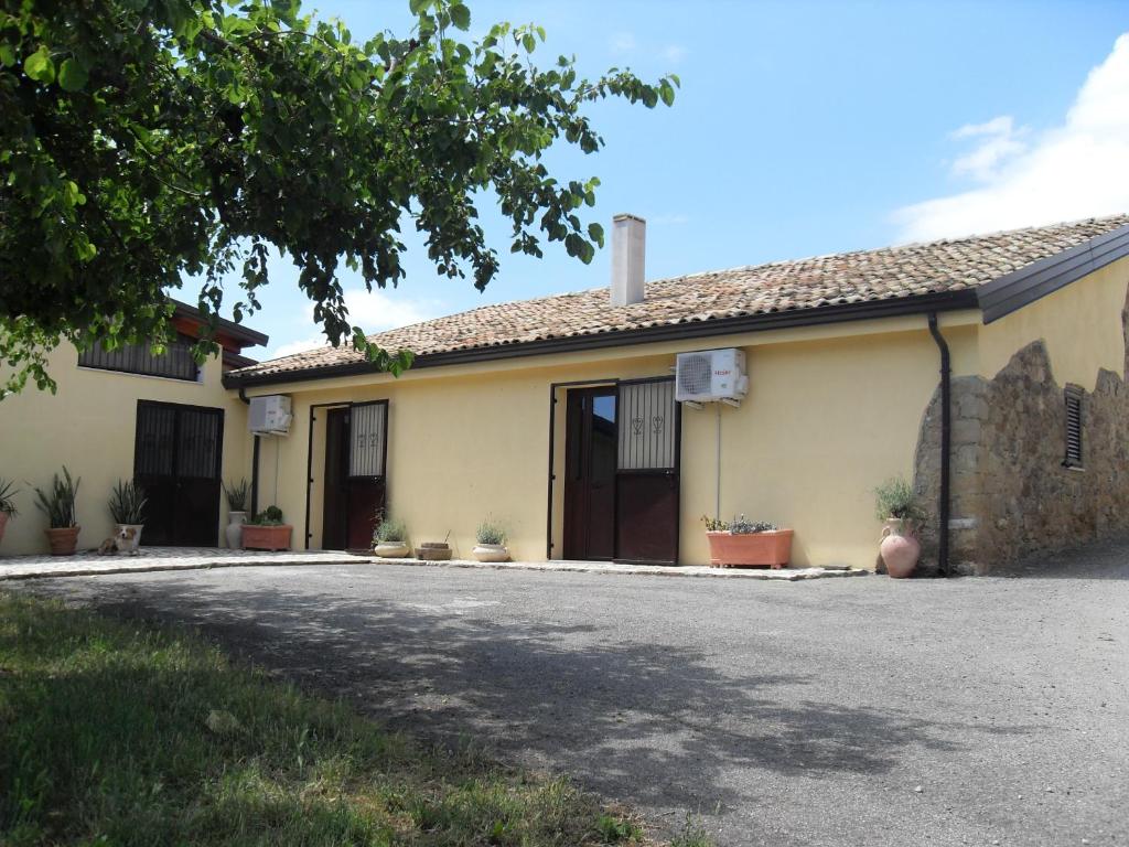 a house with a driveway in front of it at Il Terrazzo Sul Sinni in Rotondella