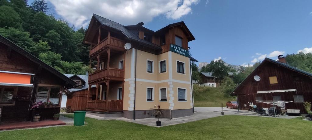 a large house in the middle of a yard at Apartment Angerer in Bad Aussee