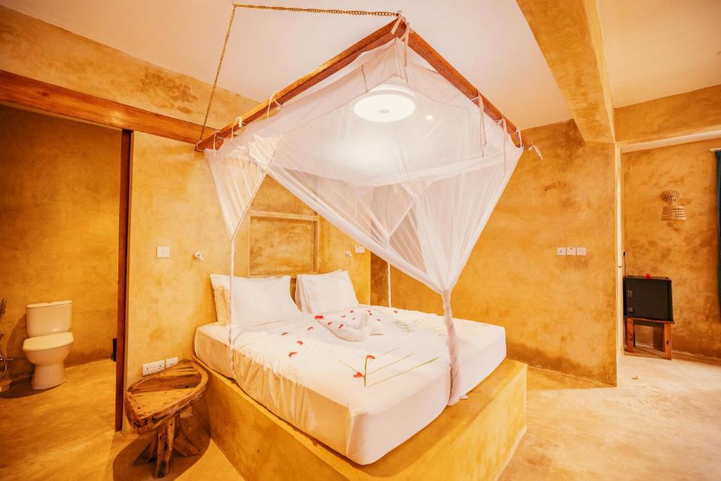 Postel nebo postele na pokoji v ubytování Mayai Ocean Resort