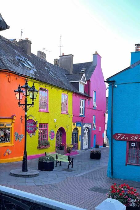 a group of colorful buildings on a city street at Heart of kinsale in Kinsale