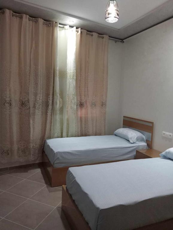 Postel nebo postele na pokoji v ubytování Appartments Achahbar