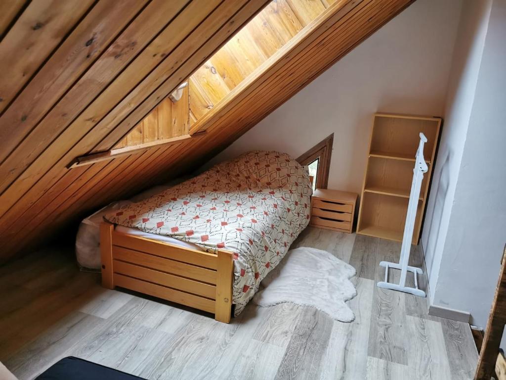 Säng eller sängar i ett rum på Appartement Chalet Pra Loup