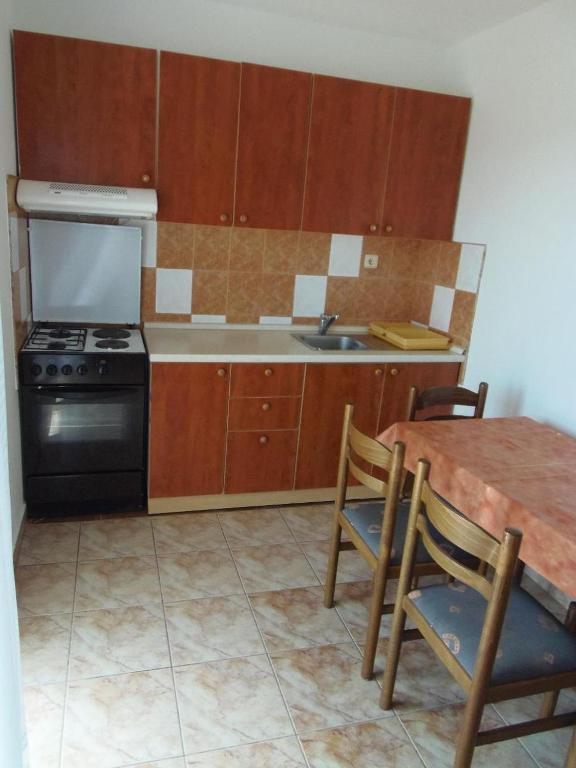 Kuchyň nebo kuchyňský kout v ubytování Apartments Zoran