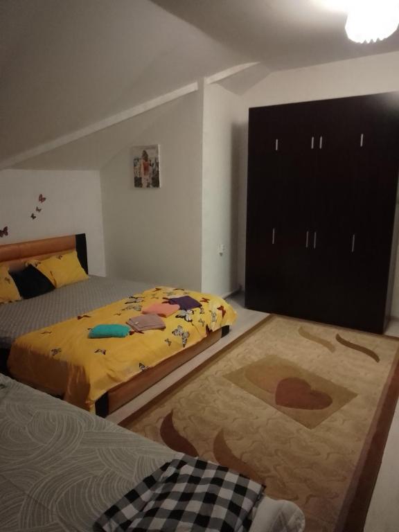 Postel nebo postele na pokoji v ubytování Casa Mocanu