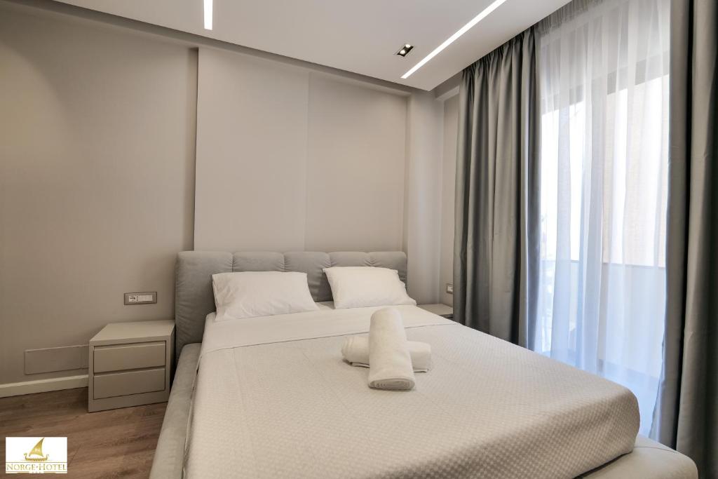 Postel nebo postele na pokoji v ubytování Norge Hotel