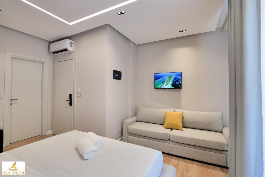 Postel nebo postele na pokoji v ubytování Norge Hotel