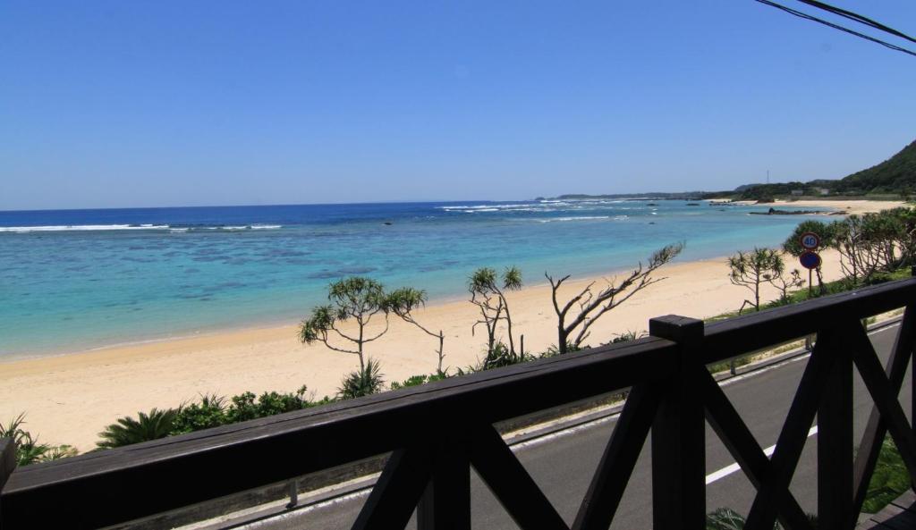 a view of a beach from a balcony at yunoya-yunoya- - Vacation STAY 14457 in Amami