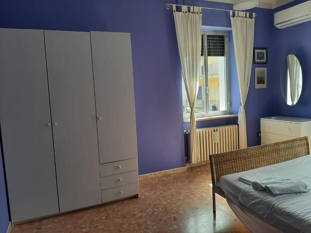 Łóżko lub łóżka w pokoju w obiekcie Casa vacanze Omero 2
