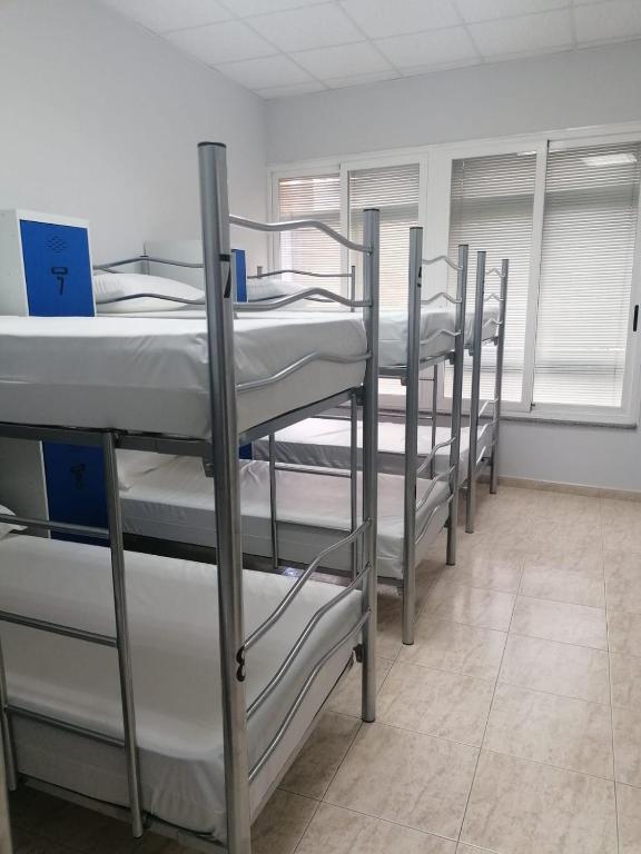 Postel nebo postele na pokoji v ubytování Albergue El Templarin