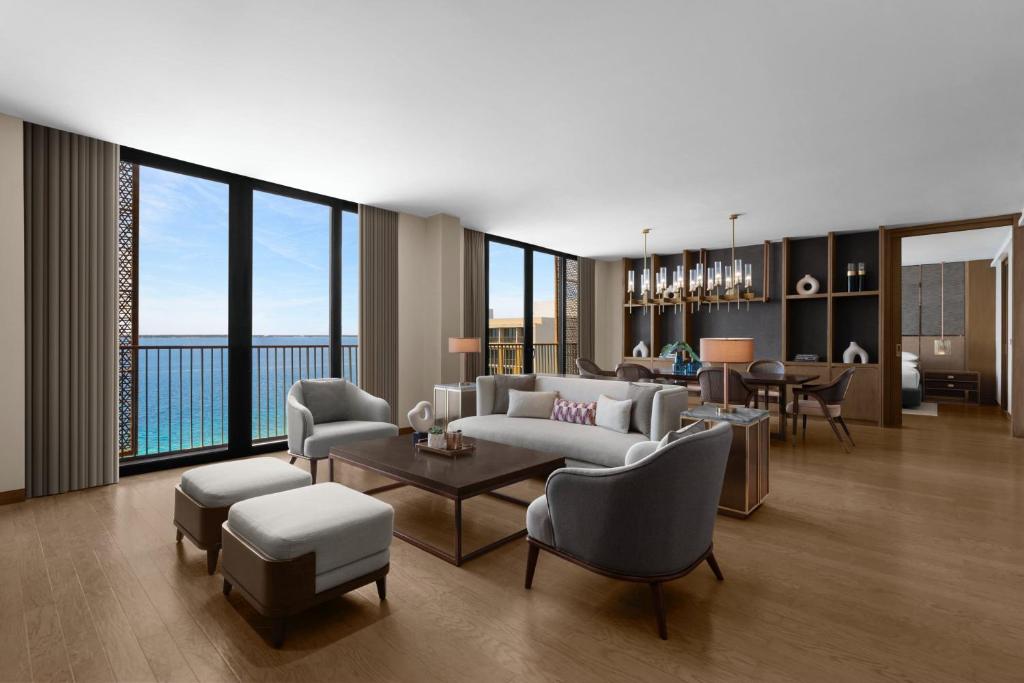 a living room with a couch and chairs and a table at Sheraton Cebu Mactan Resort in Mactan
