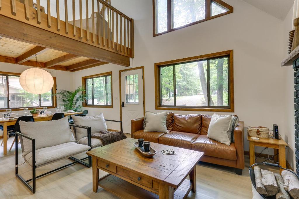 a living room with a couch and a table at Screened Porch and Grill Lake Ariel Vacation Rental in Lake Ariel
