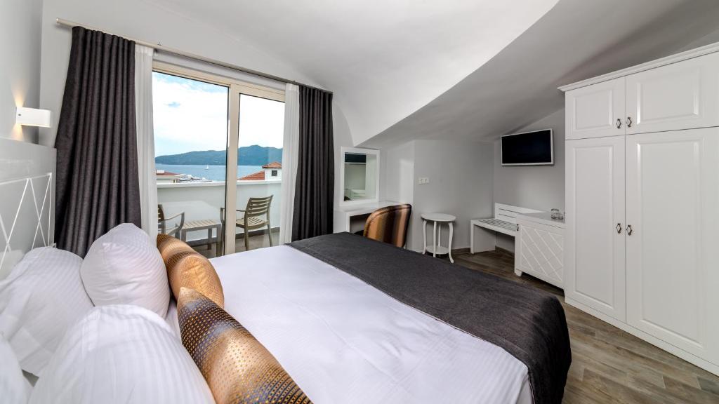 Кровать или кровати в номере Motto Premium Hotel&Spa