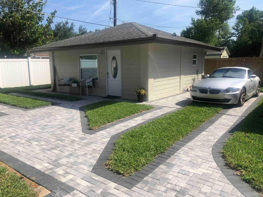 a car parked in front of a house at Roy's guest house in Orlando