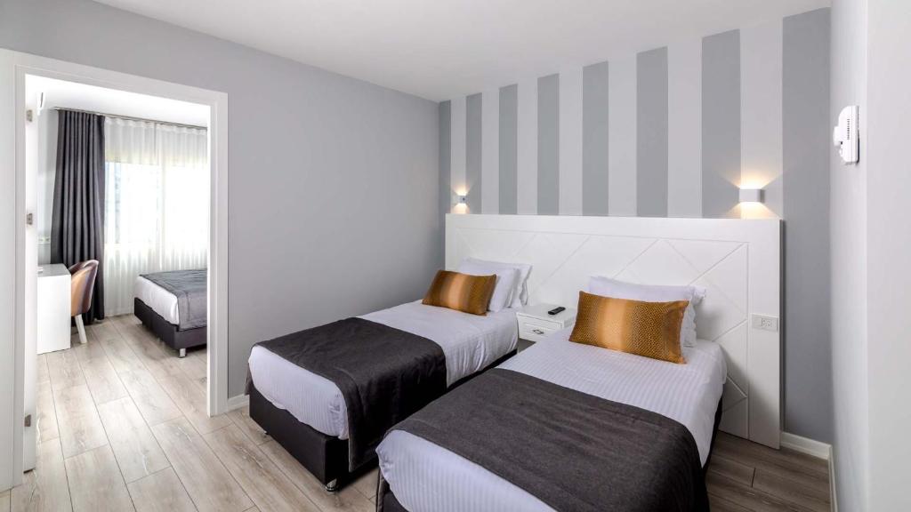 Кровать или кровати в номере Motto Premium Hotel&Spa