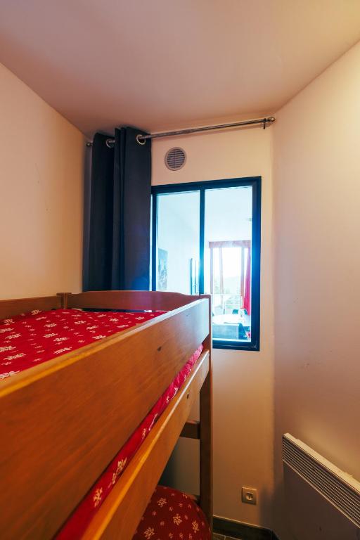 Łóżko lub łóżka w pokoju w obiekcie Mystic Mountain Apartment Chamrousse