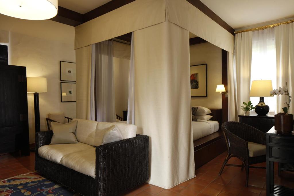 Postel nebo postele na pokoji v ubytování Rachamankha Hotel