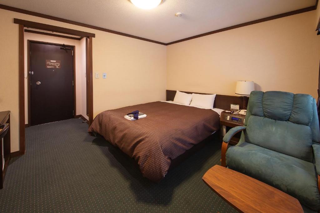 Postel nebo postele na pokoji v ubytování Hotel Hotaka