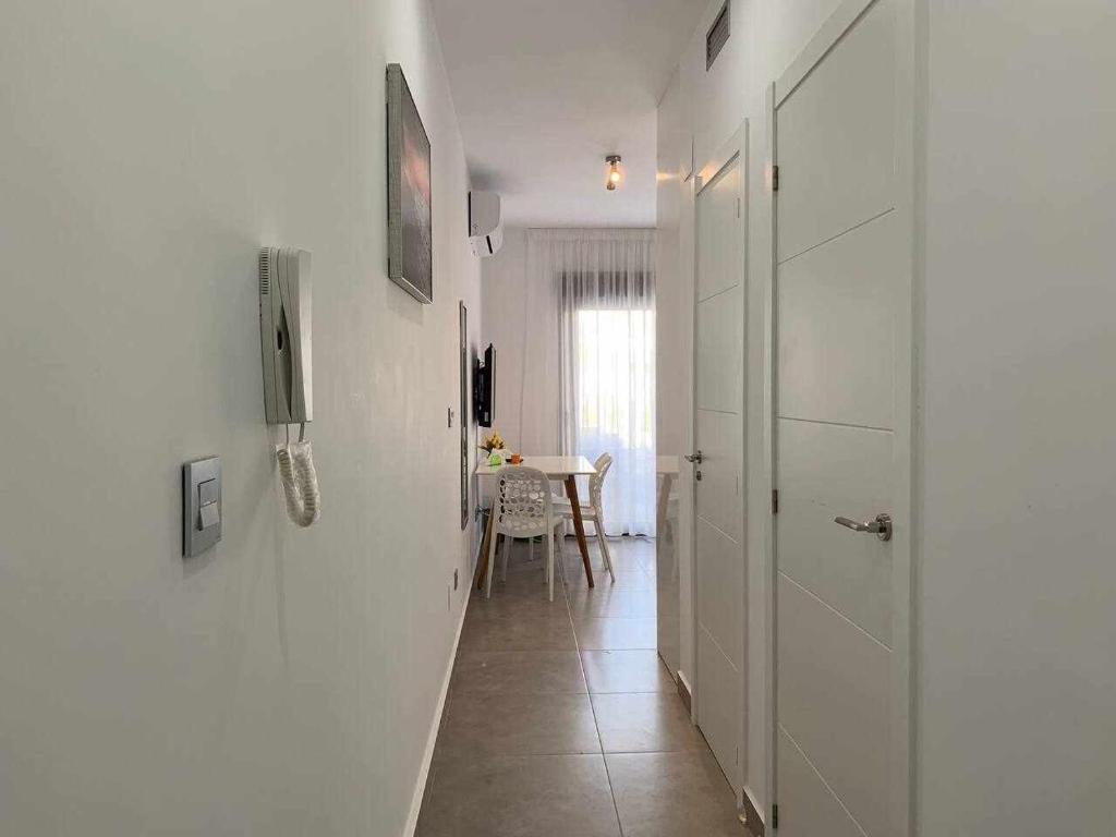TV a/nebo společenská místnost v ubytování Hermoso estudio en Pilar de la Horadada