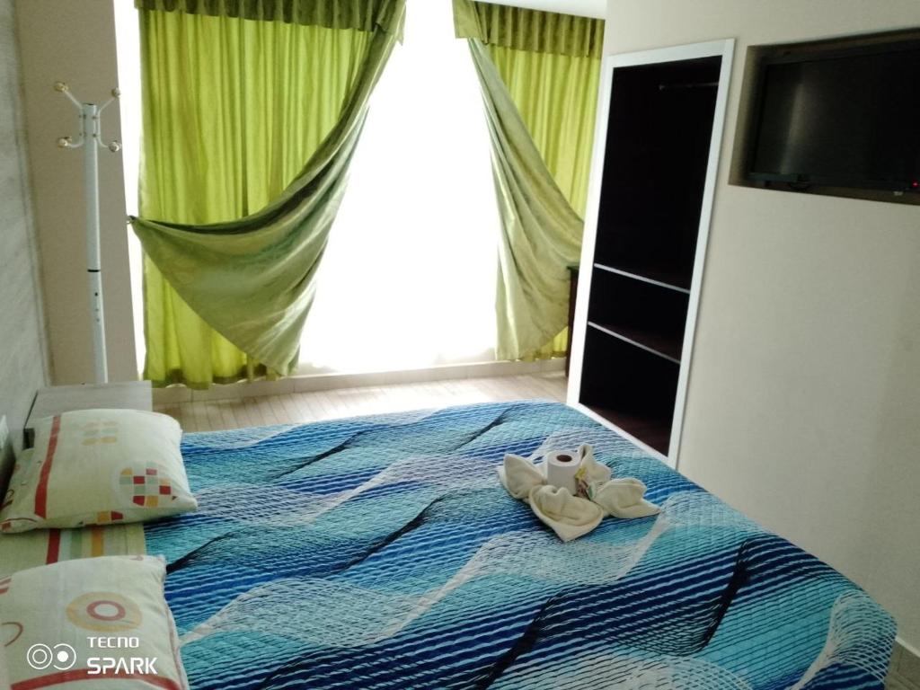Postel nebo postele na pokoji v ubytování HOSPEDAJE YACUCALLE