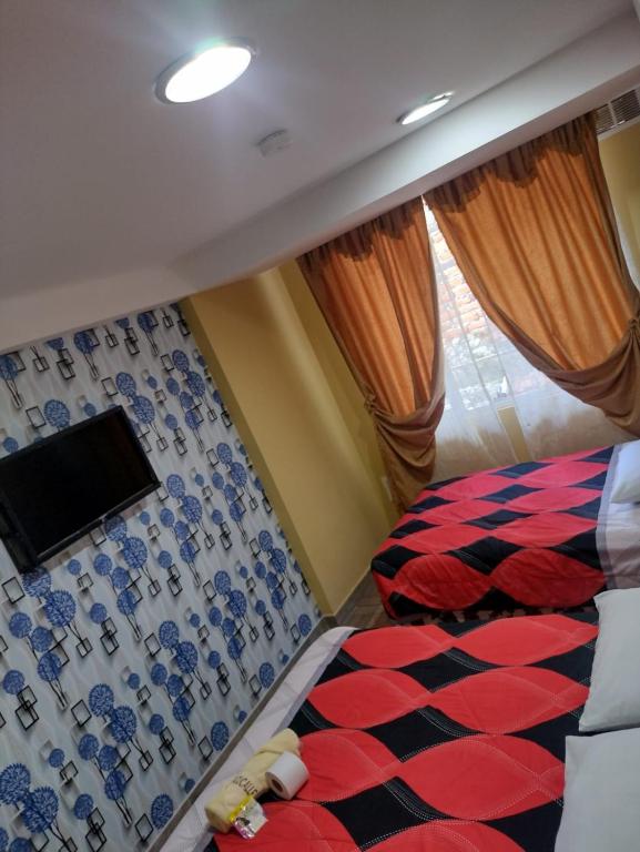Postel nebo postele na pokoji v ubytování HOSPEDAJE YACUCALLE