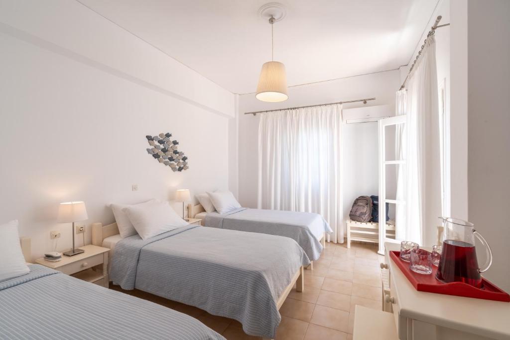 Een bed of bedden in een kamer bij Hotel Matina