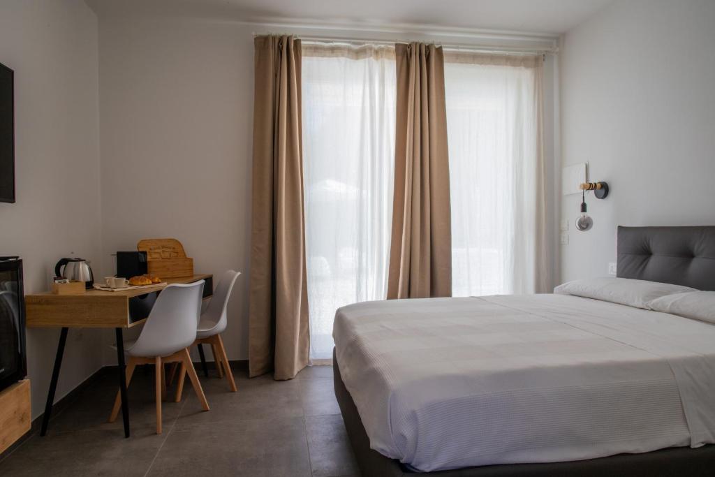 Postel nebo postele na pokoji v ubytování Ulivo Bianco