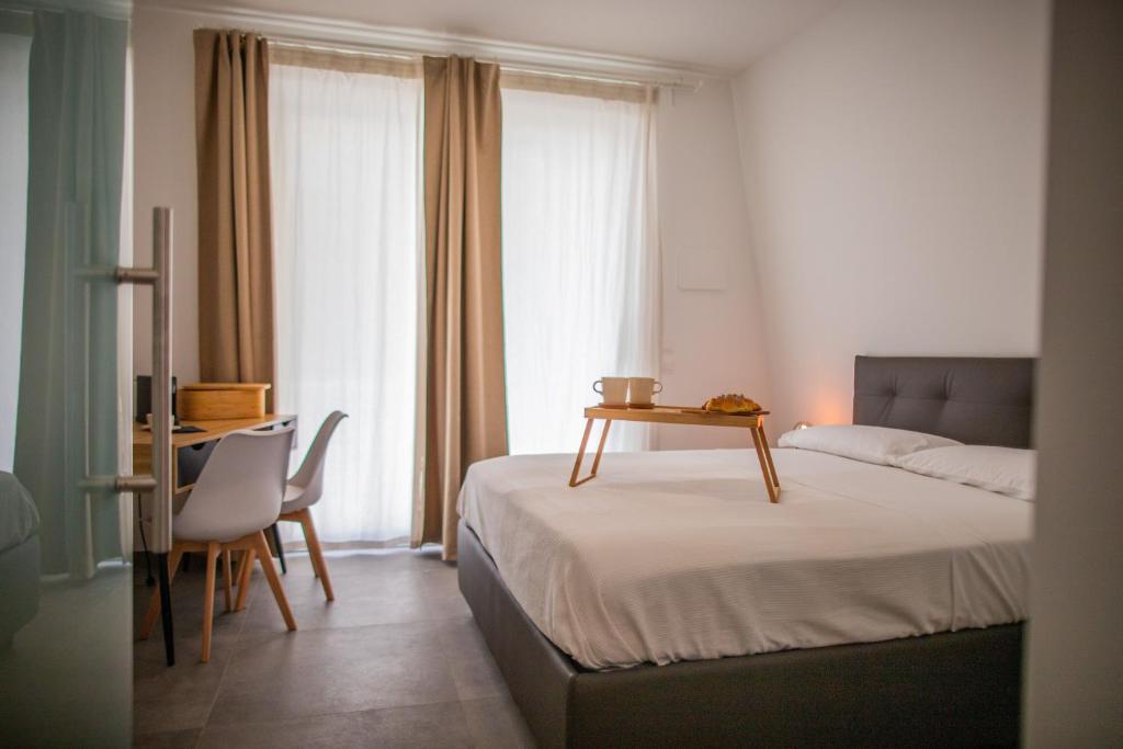 Postel nebo postele na pokoji v ubytování Ulivo Bianco