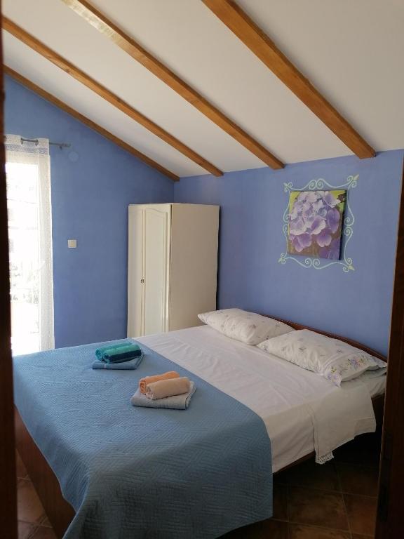 Posteľ alebo postele v izbe v ubytovaní Apartment Kukljica 8209a