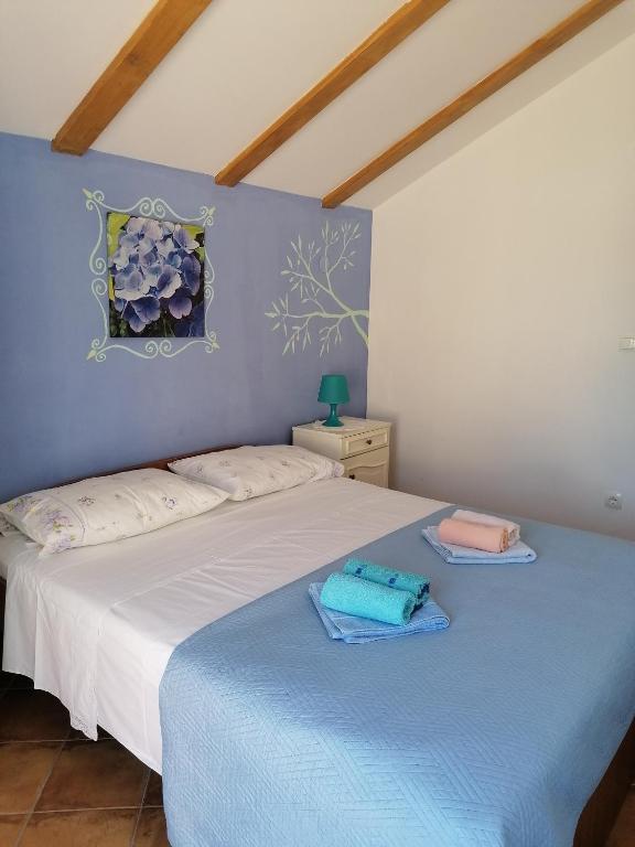 Posteľ alebo postele v izbe v ubytovaní Apartment Kukljica 8209a