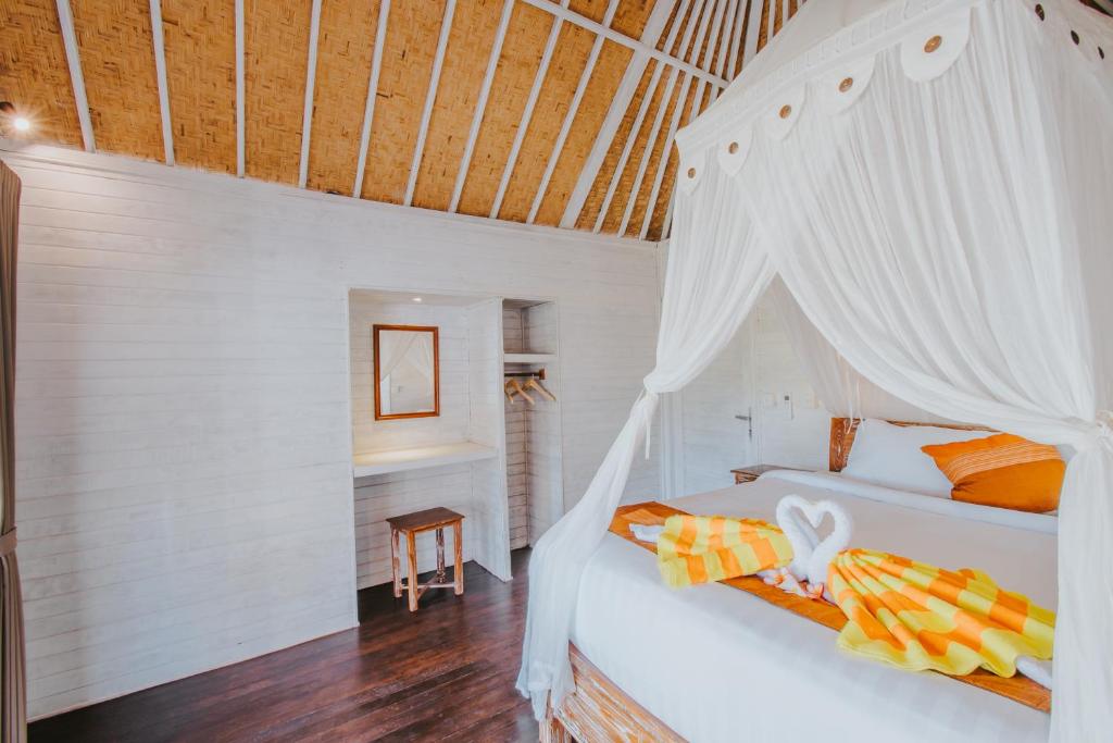 Postel nebo postele na pokoji v ubytování Paluh Beach Huts