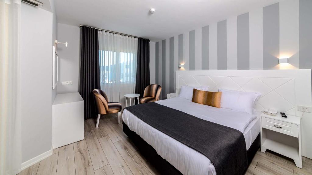 Кровать или кровати в номере Motto Premium Hotel&Spa