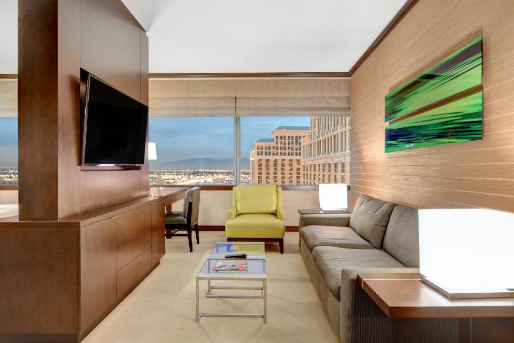 a living room with a couch and a tv at Vdara Hotel & Spa in Las Vegas