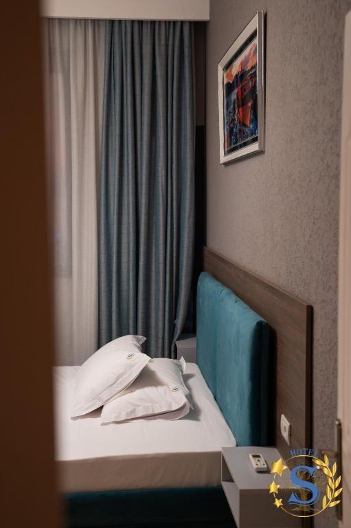 Postel nebo postele na pokoji v ubytování Sofia Hotel