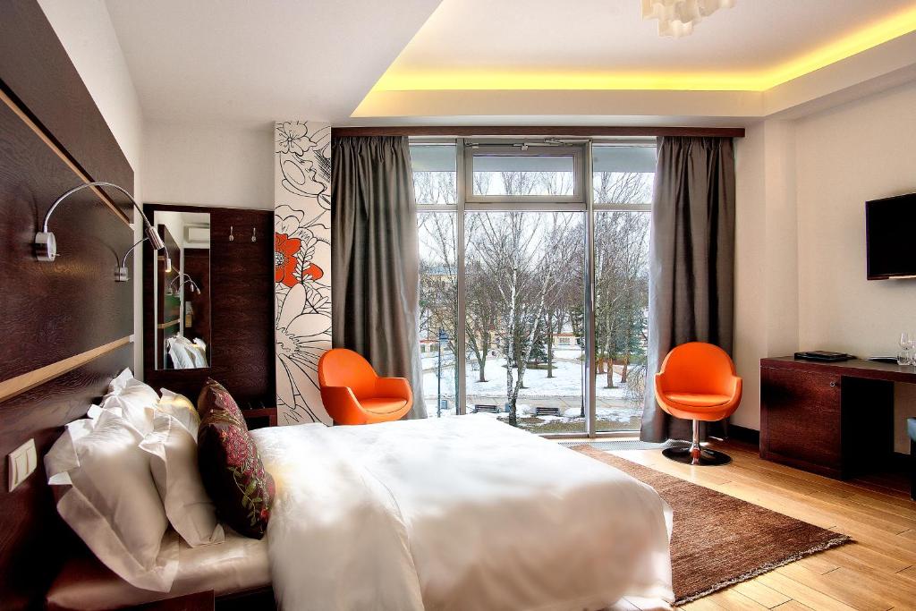 Posteľ alebo postele v izbe v ubytovaní BoutiqueHotel Aristo