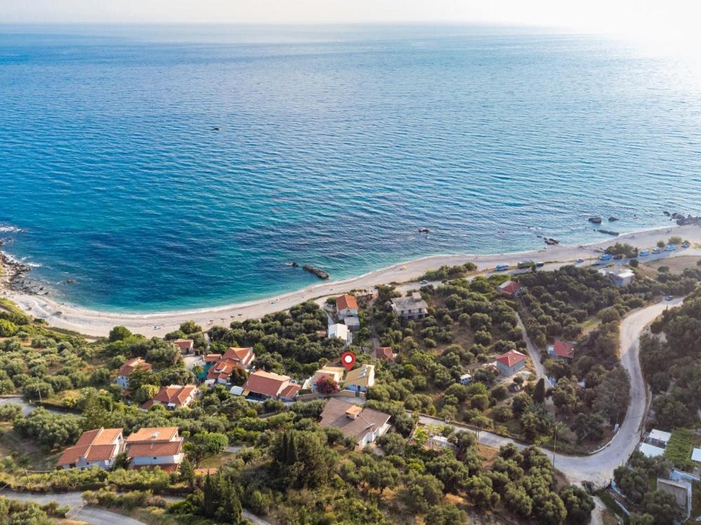 an aerial view of a beach next to the ocean at Costa Mare in Paralia Vrachou