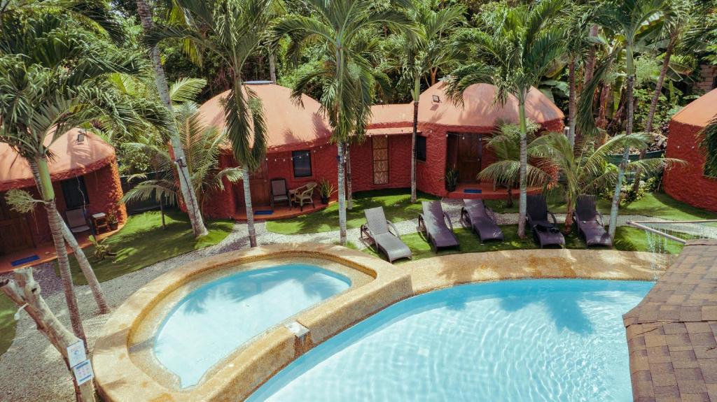 an overhead view of a swimming pool in front of a resort at Panglao Chocolate Hills Resort in Panglao Island