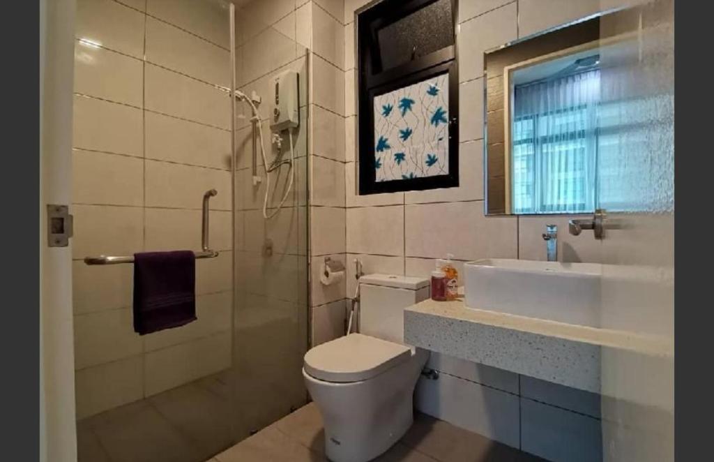a bathroom with a toilet and a sink at Conezion Residence Putrajaya WiFi Netflix in Putrajaya