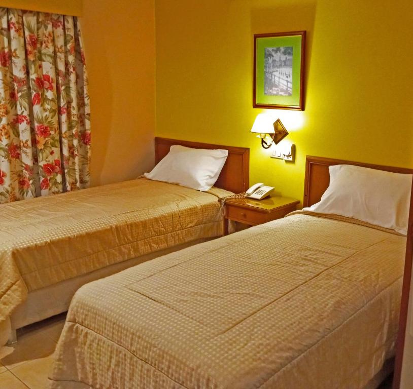 Postel nebo postele na pokoji v ubytování Hotel Bristol Asuncion