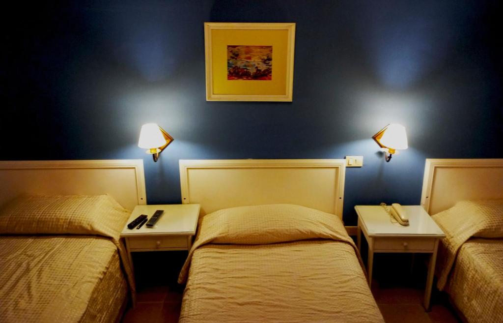 Postel nebo postele na pokoji v ubytování Hotel Bristol Asuncion