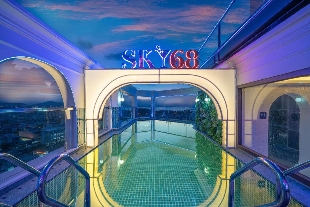 a balcony with a swimming pool on a building at La Belle Vie Boutique Hotel in Da Nang