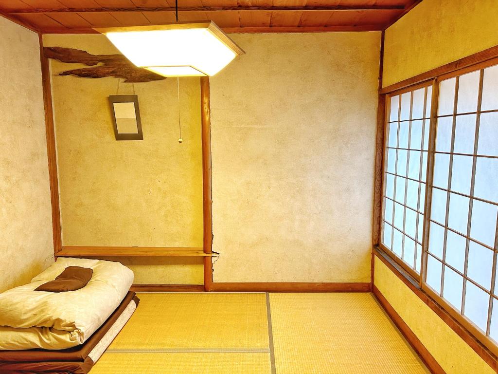 Postel nebo postele na pokoji v ubytování Izumo guesthouse itoan