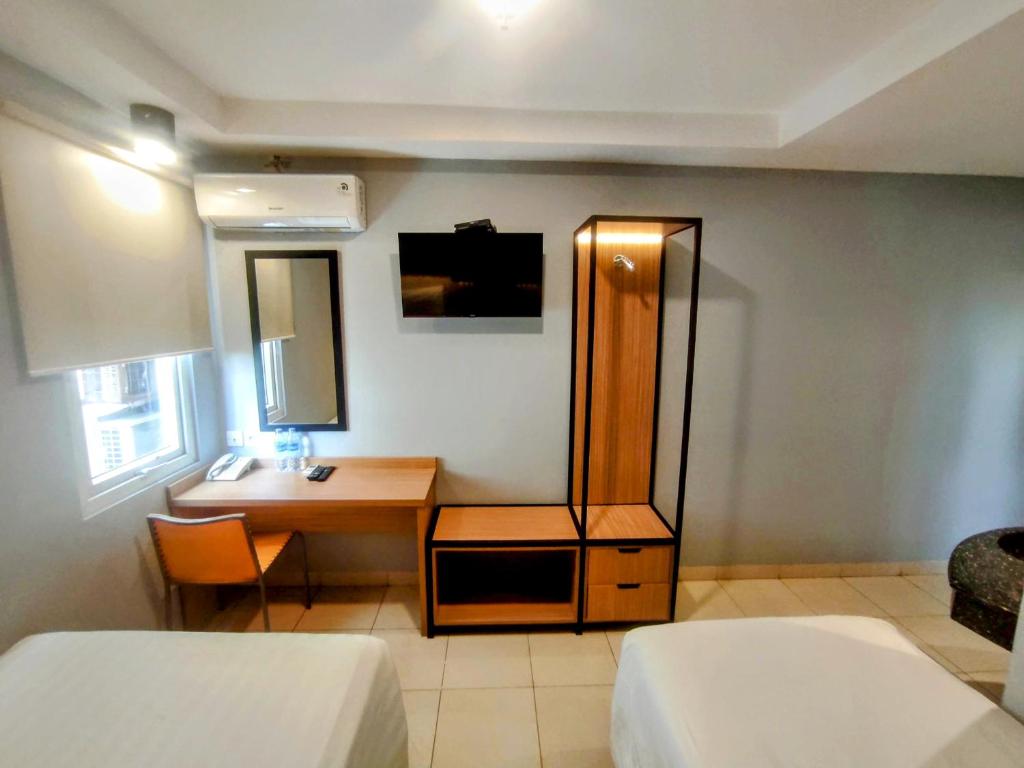 Voodi või voodid majutusasutuse Studio One Thamrin Hotel toas