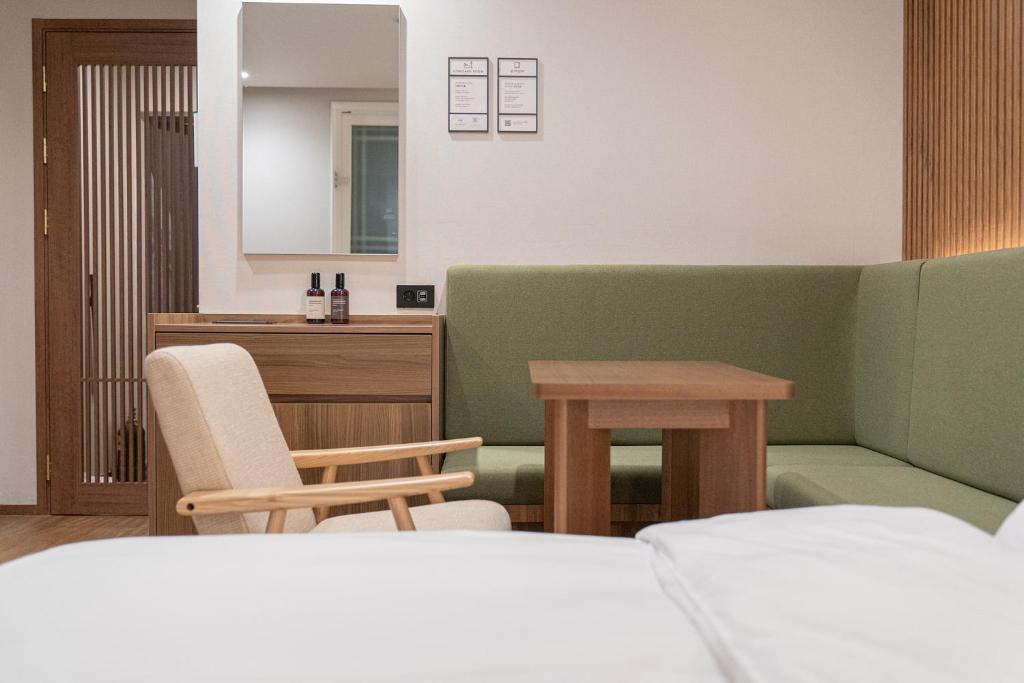 Postel nebo postele na pokoji v ubytování Simjak Hotel by Aank