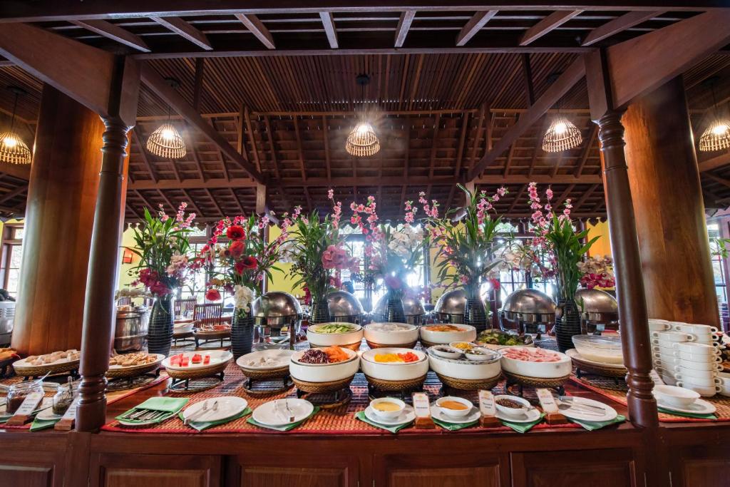 a buffet with many plates of food on a table at Royal Crown Hotel & Spa in Siem Reap