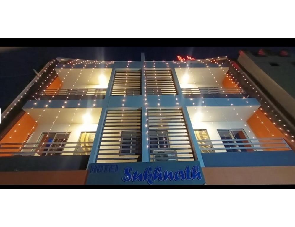 a picture of a building with lights on it at Hotel Sukhnath, Somnath in Somnath